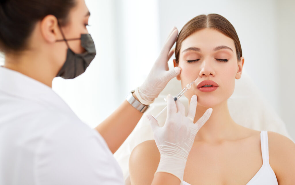 A Woman getting injection on cheeks | Healthy Glow Medspa | Best Medical Spa in Orlando, FL